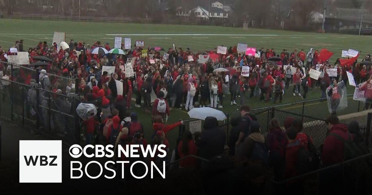 Dozens of North Andover students walk out to protest job cuts - CBS Boston