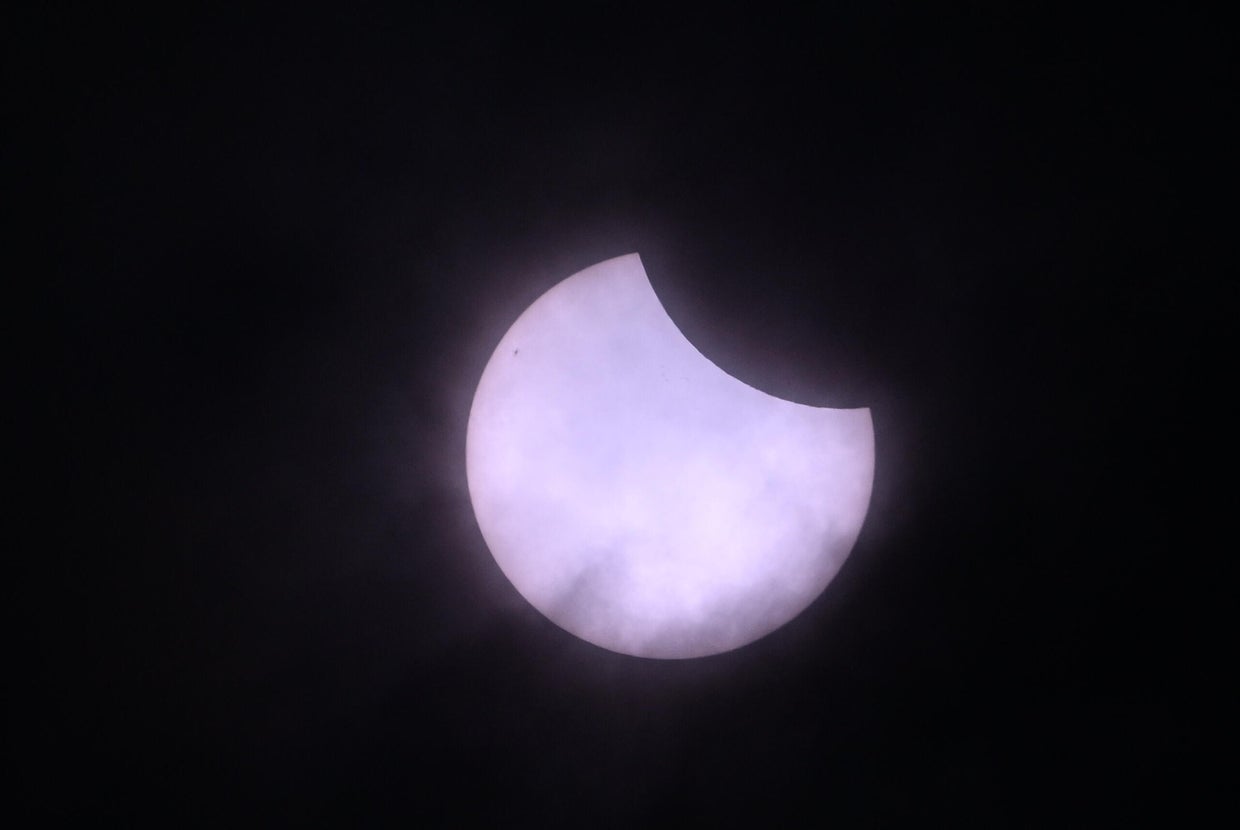 See photos of the March partial solar eclipse, where the moon passes in ...