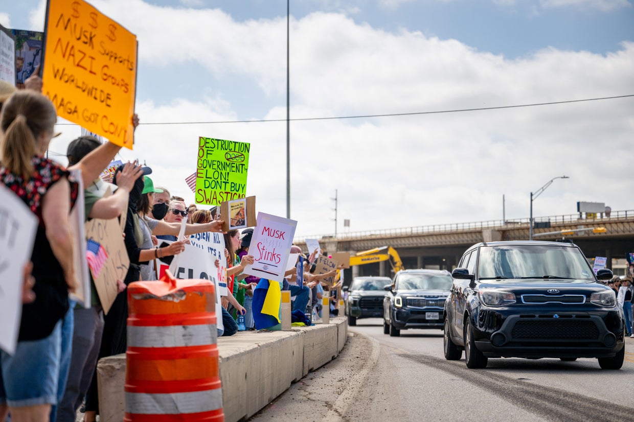 Protesters rally against Elon Musk at Tesla showrooms over the ...