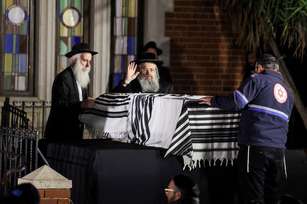 FILE PHOTO: Mourners attend the funeral of Israeli rabbi, Zvi Kogan, in Kfar Habad