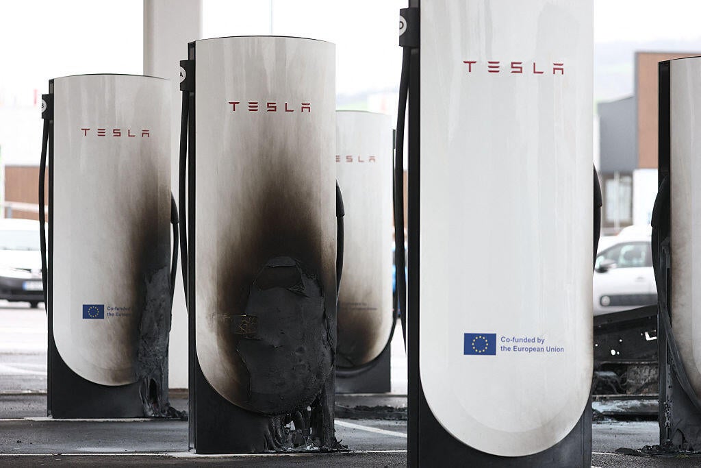 A photo shows damaged and destroyed Tesla charging stations in Saint-Chamond on March 29, 2025