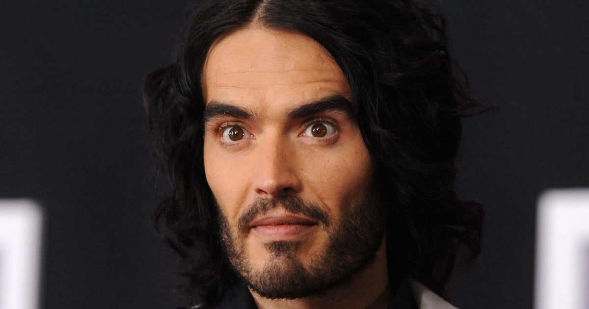 Russell Brand charged with multiple counts of rape, sexual assault in U.K. - CBS News