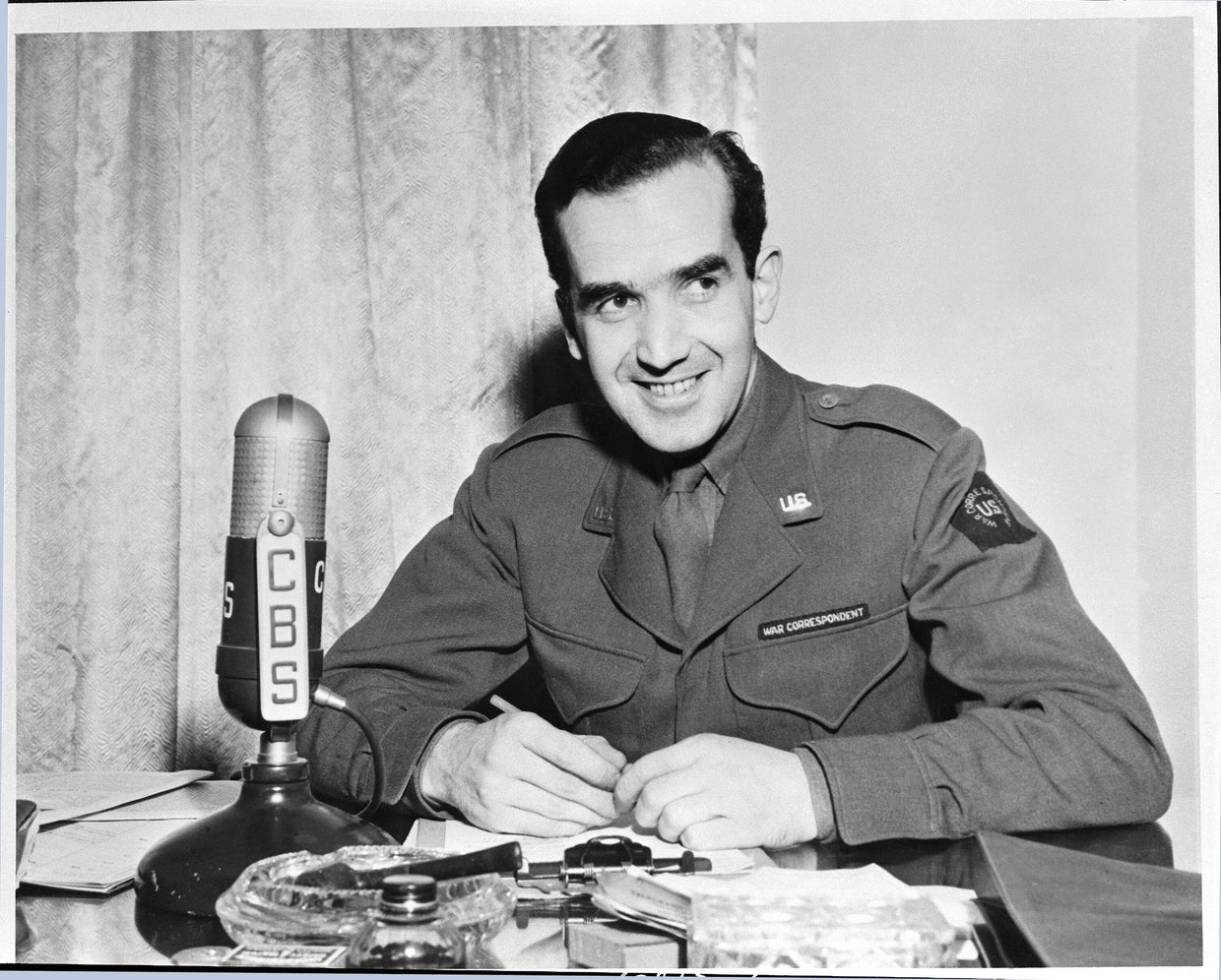 CBS correspondent Edward R. Murrow (1908-1965) is seen in a U.S. military war correspondent's uniform reporting on World War II from London, England, in January 1944