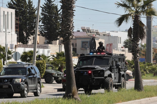 Security forces operate near a crime scene where a U.S. citizen shot and killed a state Mexican police officer, in Tijuana 