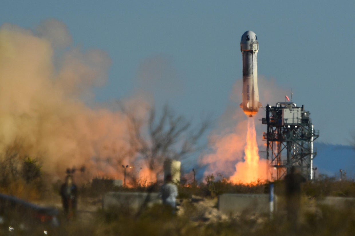 A Blue Origin New Shepard rocket launches on March 31, 2022.