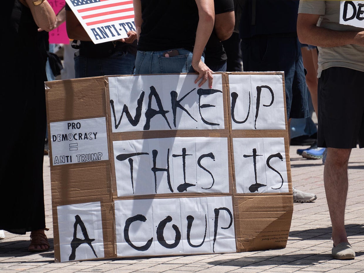 Protesters rally in Miami against Trump administration ahead of 100th day in office 
