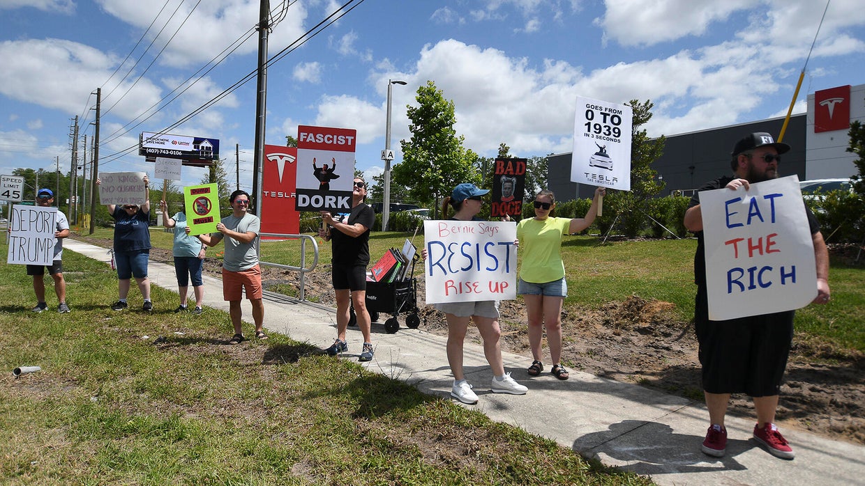 Protesteis In Front Of A Tesla Store