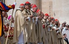 Pope Francis walks with Cardinal Gerald Cyprien Lacroix 