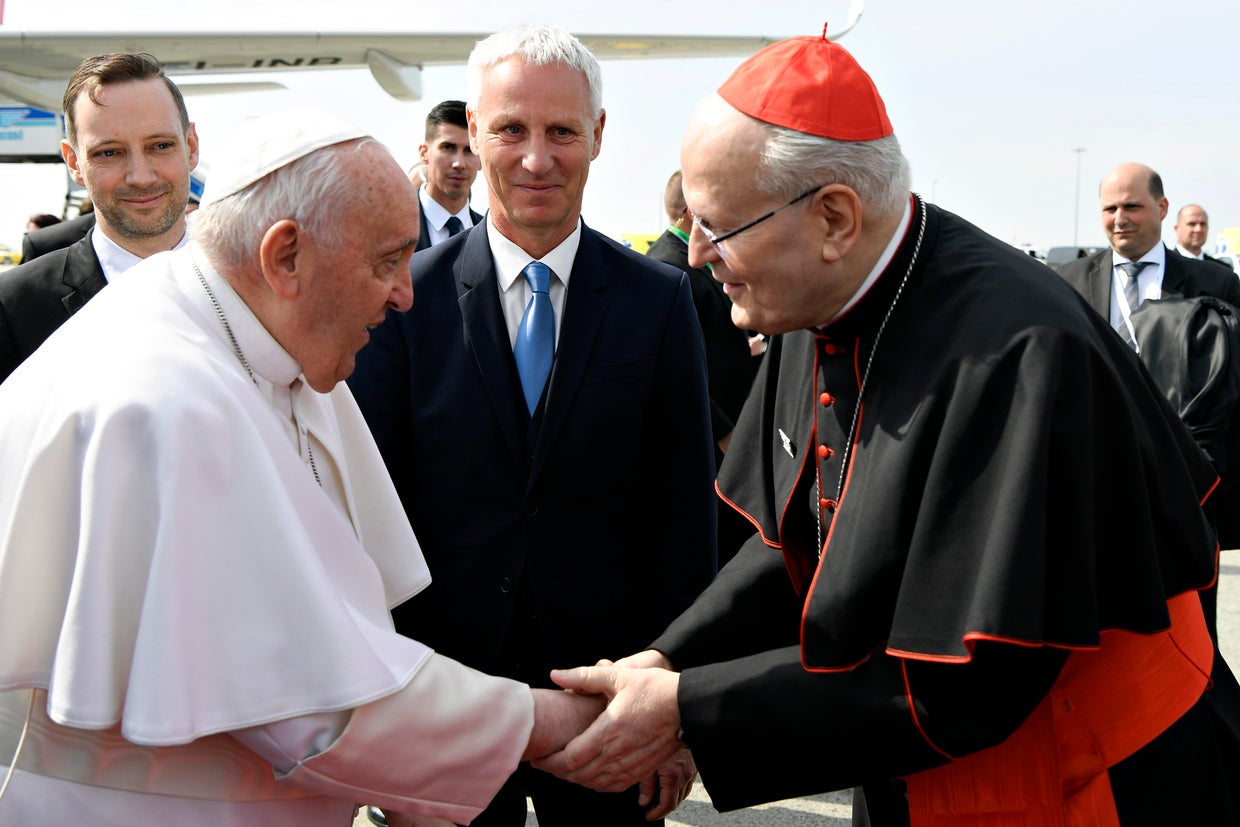Pope Francis greets archbishop of Budapest Cardinal Peter Erdo