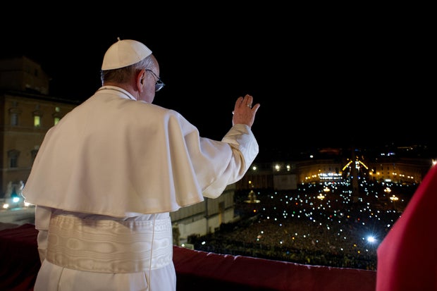 The newly chosen Pope Francis greets the crowd in St. Peter's in 2013
