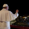 Newly elected Pope Francis waves to the crowd at St. Peter's in 2013 