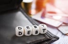 Debt credit card and money coin stack Increased liabilities from exemption debt consolidation,Romania 