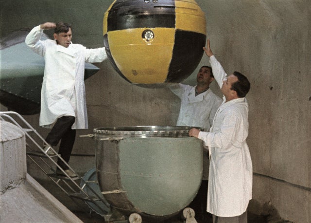The descent capsule of soviet space probe venera 5 or 6 being lowered into a centrifuge for testing, this is a still from the film 'the storming of venus', produced by e, kuzis at the tsentrnauchfilm central scientific film studio, released on may 17 