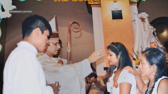 A photo of Fernanda Custodio being confirmed by Pope Leo XIV, who was a bishop at the time 