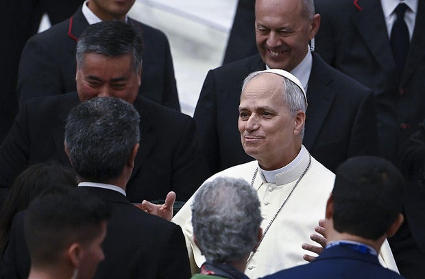 Pope Leo XIV greets journalists during an audience with media representatives in the Paul VI hall at the Vatican