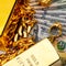 Pros and cons of selling your gold investment now