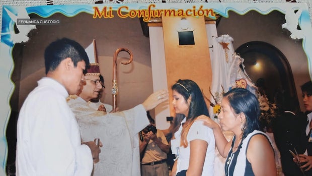 A photo of Fernanda Custodio being confirmed by Pope Leo XIV, a bishop at the time 