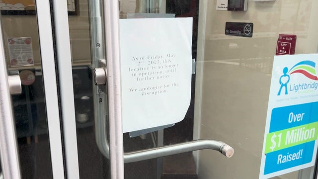 A sign on the door of Lightbridge Academy's Midtown location reading, "As of Friday, May 2nd, 2025, this location is no longer in operation, until further notice. We apologize for the disruption." 