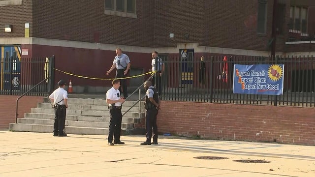 Do not enter. Yellow caution tape on the metal fence at daytime. Crime scene 