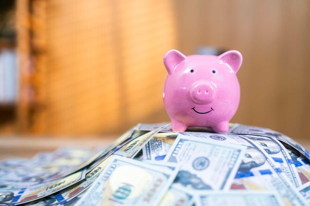Piggy bank with dollars banknotes.Some similar pictures