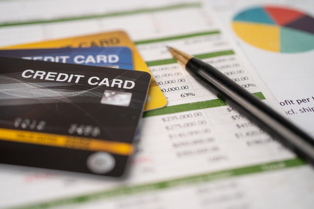 Credit card on spreadsheet paper. Finance development, Banking Account, Statistics, Investment Analytic research data economy, Stock exchange trading, Business company concept.