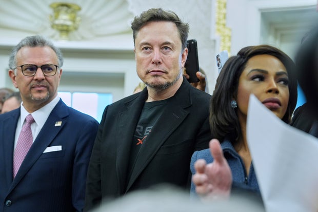 Elon Musk looks while President Donald Trump meets South African President Cyril Ramaphosa