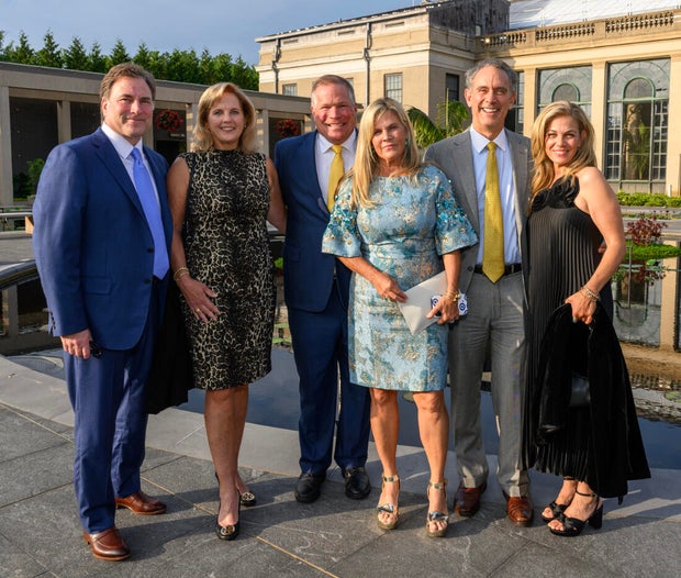 People pose for a photo at a gala for Nemours 