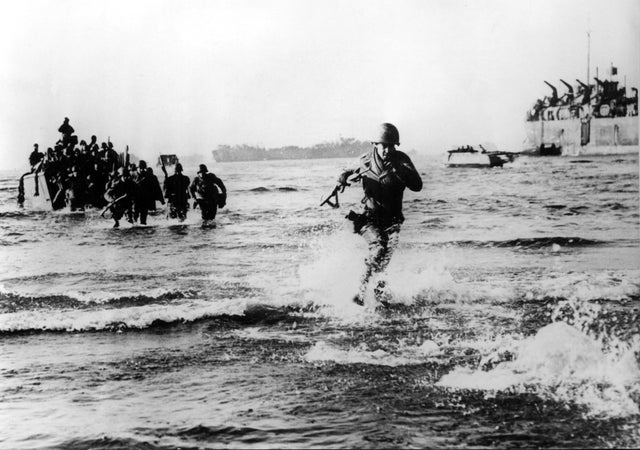U.S. troops come ashore in Italy during World War II 