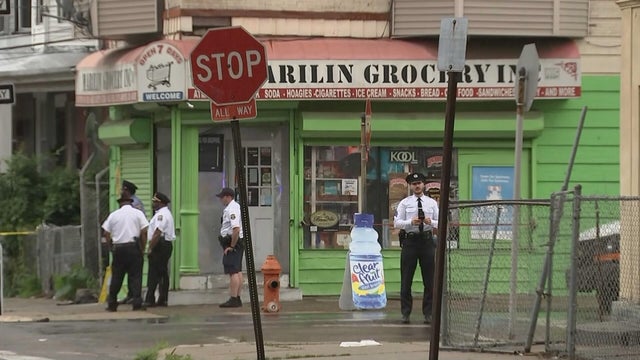 Police are standing outside a corner store in West Philadelphia 