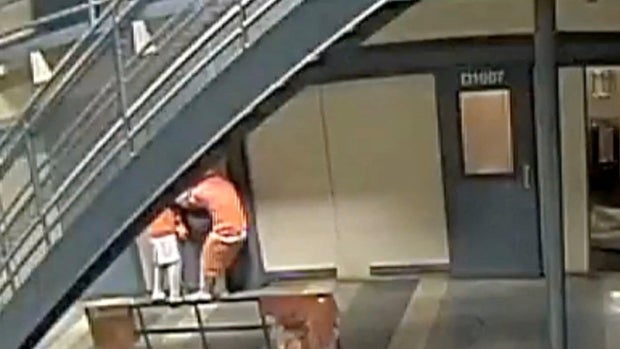 An image capture taken from surveillance video footage shows inmates pulling on a sliding cell door in the Orleans Parish Justice Center, in New Orleans, Louisiana, May 16, 2025.