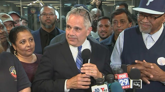 Larry Krasner speaks into a microphone at a news conference in Philadelphia 