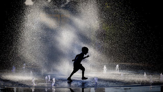 Child Playing in Splash Pad 