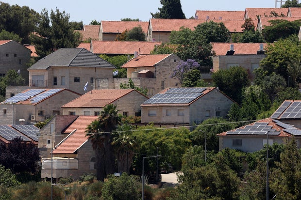 Houses in the Israeli settlement of Psagot in the occupied West Bank, located on Tawil hill adjacent to the Palestinian cities of Ramallah and al-Bireh, are seen on May 29, 2025.