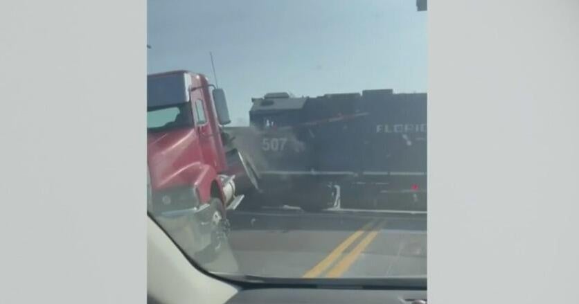 Train slams into truck stuck on tracks in Florida - CBS Miami