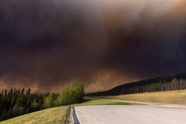 Wildfires burn in central Canada as fire threatens oil sand 