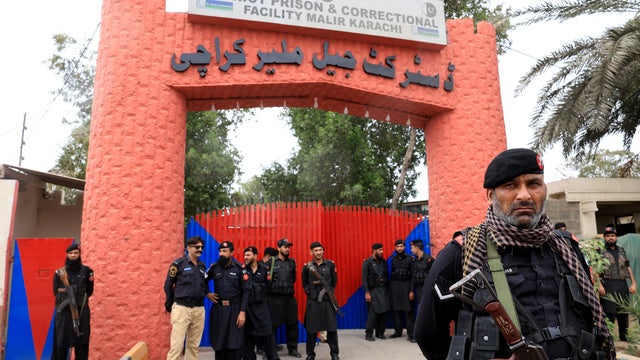 Paramilitary soldiers stand outside the district Malir jail after dozens of prisoners escaped from the jail on the outskirts of Karachi 