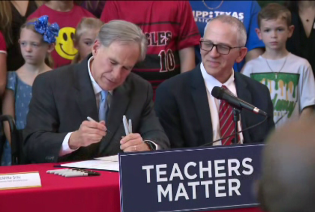abbott-signs-bill.png 