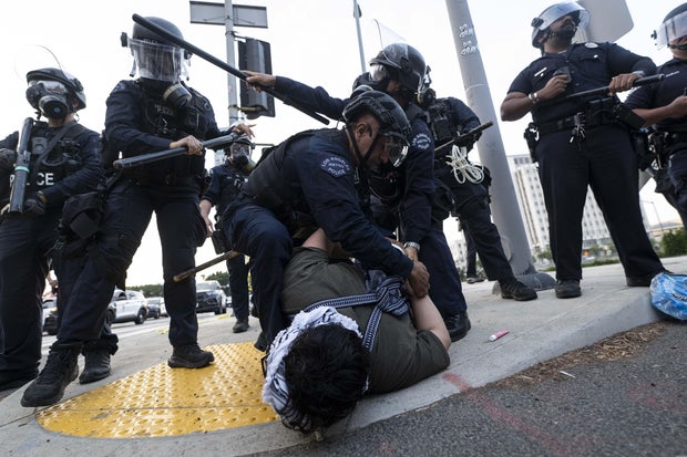 Protesters gather outside of the Federal Building in downtown Los Angeles