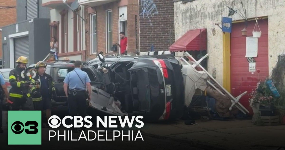 1 person taken to the hospital after car flips over on sidewalk in ...