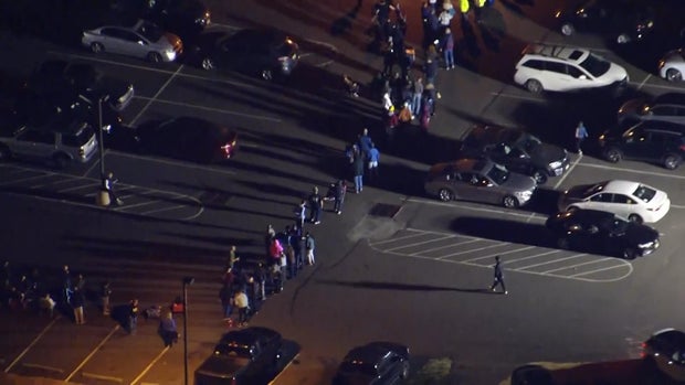 Overhead chopper photo of people waiting outside in the dark to vote in November 2025 in Burlington County, New Jersey 