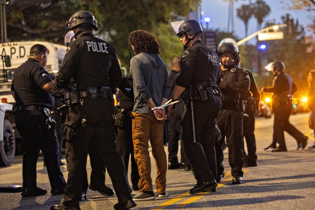 Demonstrators continue to clash with law enforcement near City Hall due to the immigration raids in L.A. 