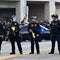 U.S. Border Patrol and Custom officers and U.S. Immigration and Customs Enforcement agents stand guard outside the federal building in Los Angeles on Wednesday, June 11, 2025. 