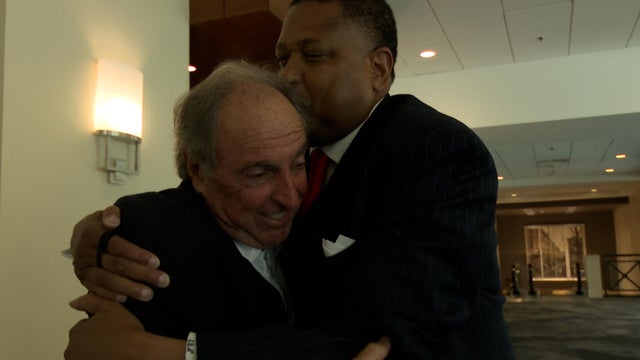 Steve Nesmith wraps Fran Dunphy in a hug 