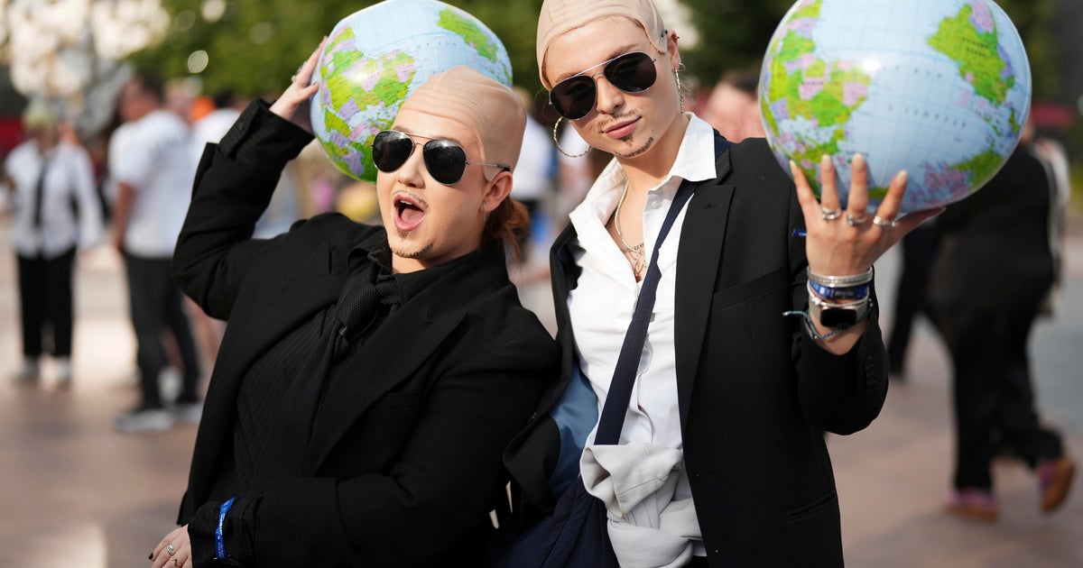 White shirts, black ties, bald caps: Pitbull’s fans party like clones worldwide White shirts, black ties, bald caps: Pitbull’s fans party like clones worldwide