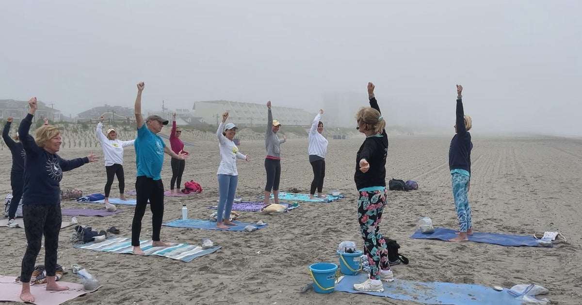 NJ Beach Yoga instructor helps students find balance in the sand 