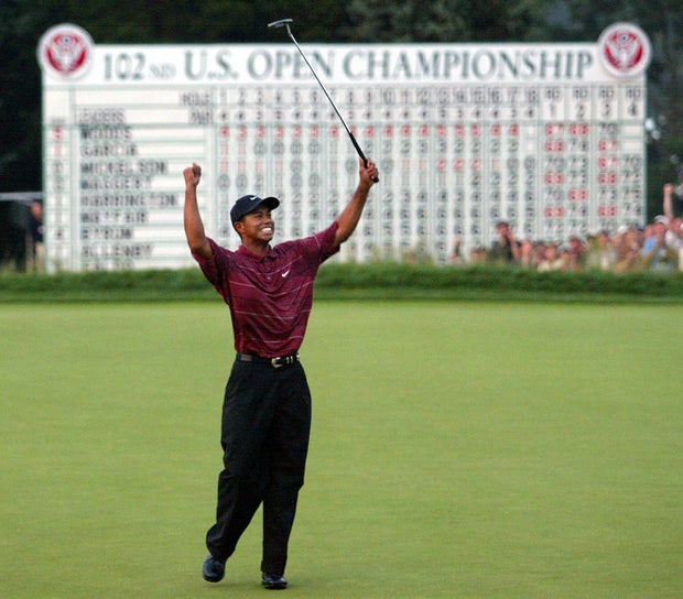 Us golfer Tiger Woods celebrates his win on the 18 