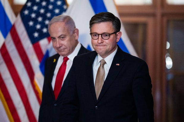 Speaker of the House Mike Johnson, right, and Israeli Prime Minister Benjamin Netanyahu, arrive to address the media after a meeting in the U.S. Capitol on Friday, February 7, 2025.