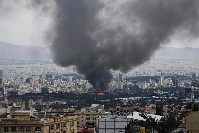Smoke rises after a reported Israeli strike on a building used by Islamic Republic of Iran News Network, part of Iran's state TV broadcaster, on June 16, 2025, in Tehran, Iran. 