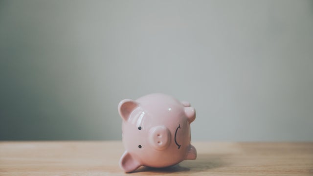 Piggy bank on wood table. Financial investment and save money concept 