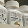 Bottles of prescription painkiller OxyContin made by Purdue Pharma LP sit on a shelf at a local pharmacy in Provo, Utah, April 25, 2017. 